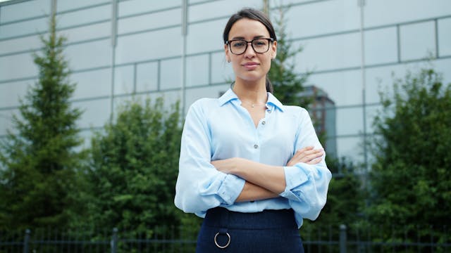 Professional standing in front of an office building